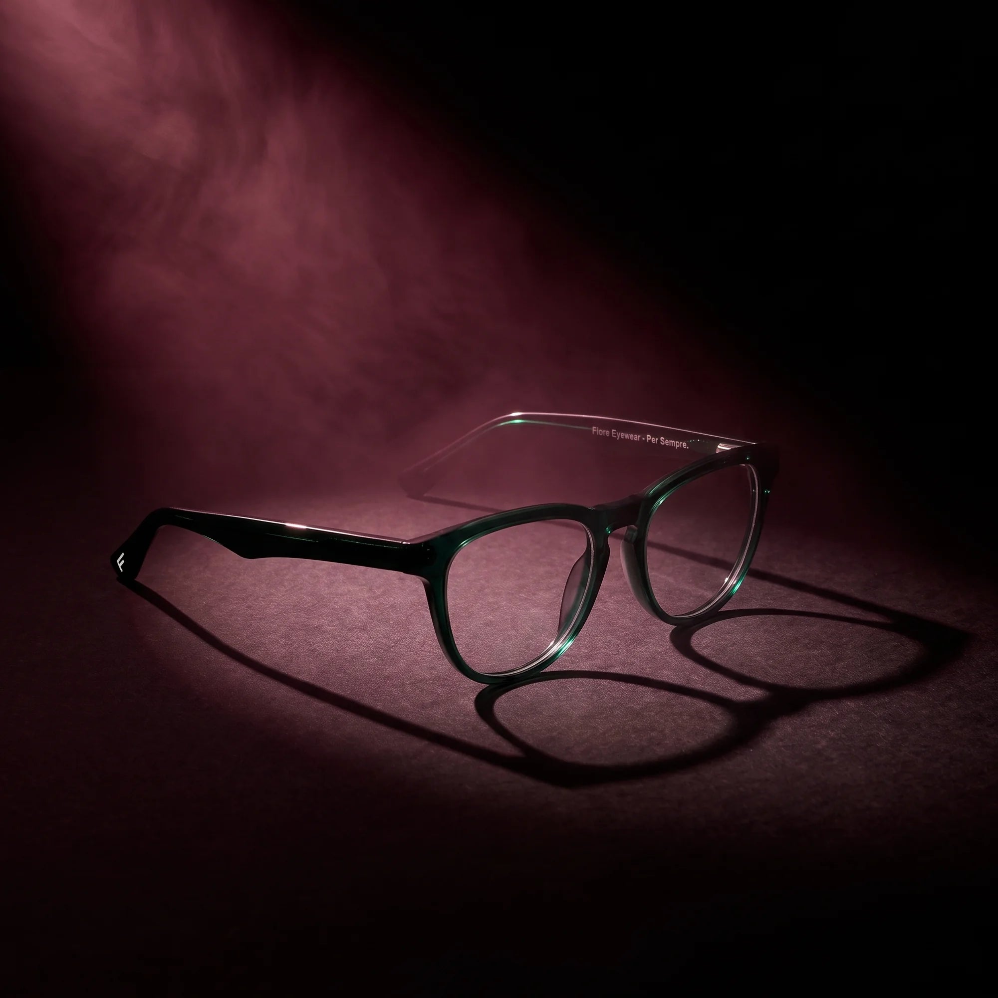 Fiore 4488 eyeglasses in green – under a theatrical beam of light