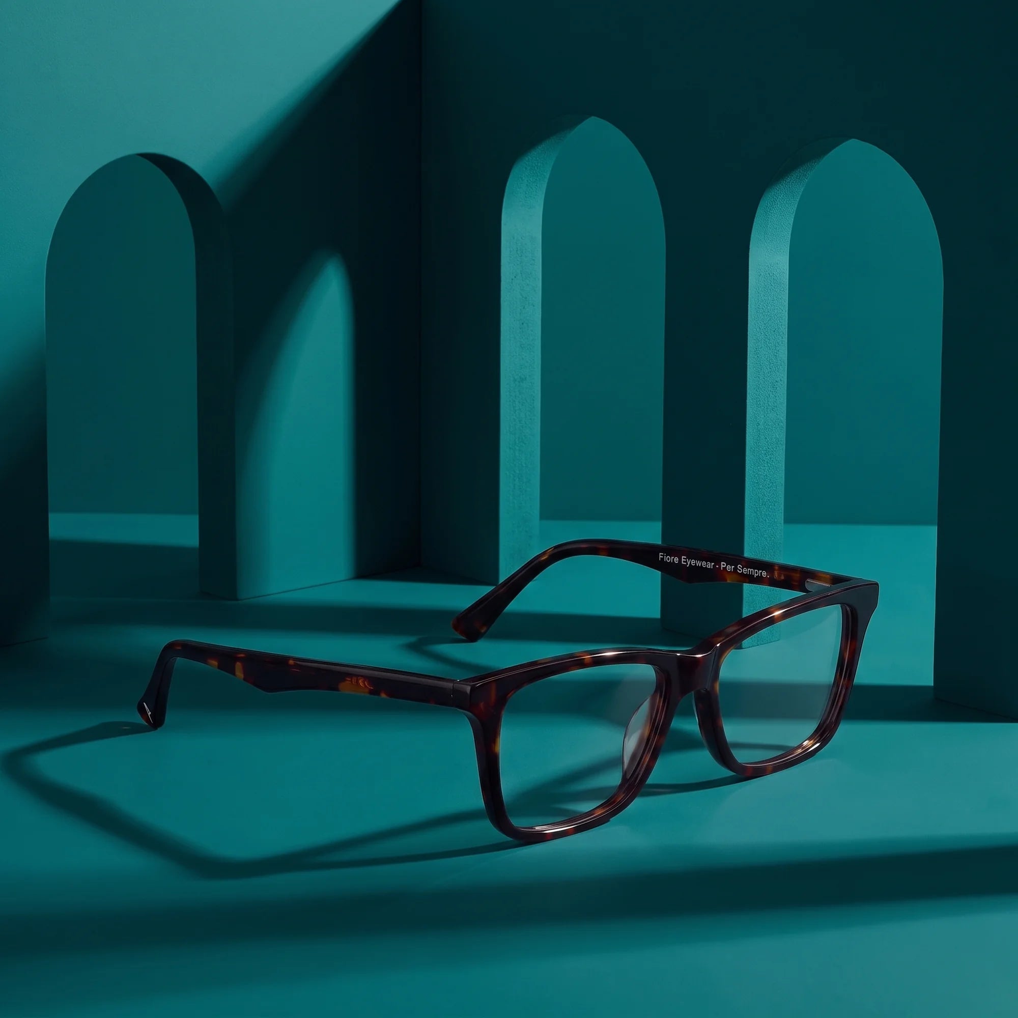 Fiore 5228 eyeglasses in tortoiseshell – still life among monochrome teal arches