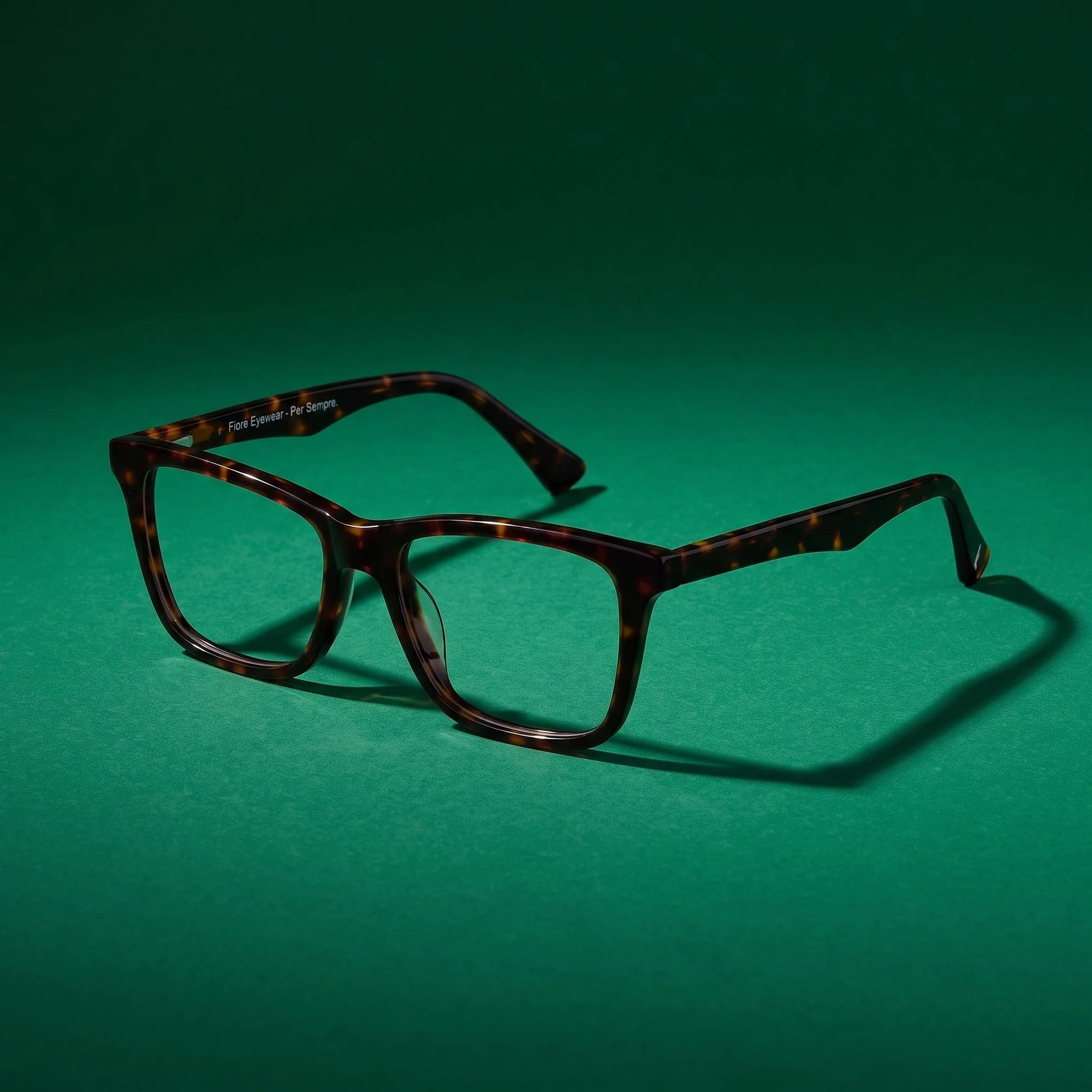 Fiore 5228 eyeglasses in tortoiseshell – still life on a seamless emerald studio backdrop