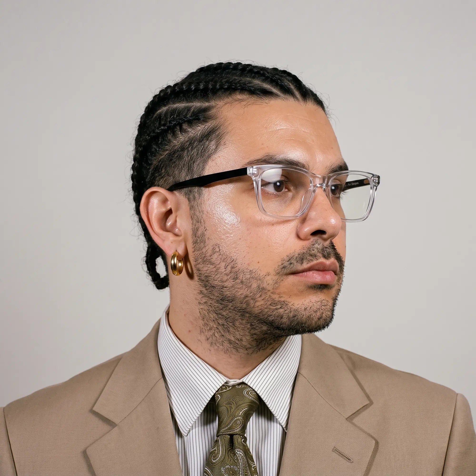 Fiore 5228 eyeglasses in transparent, worn by a model – campaign portrait, clean beige studio three-quarter portrait