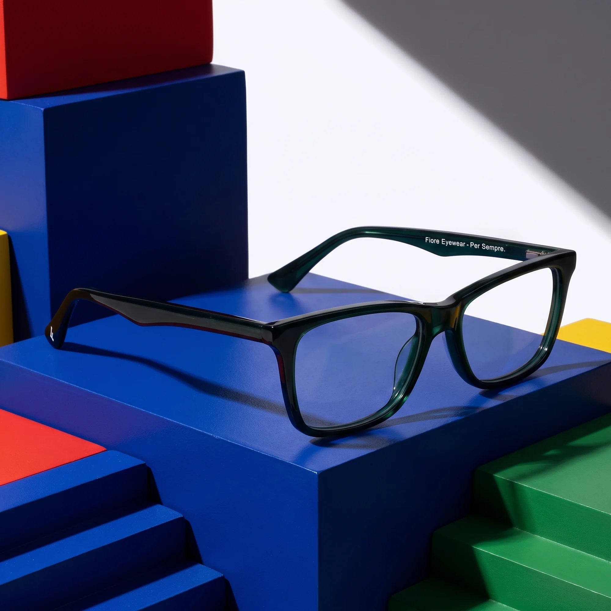 Fiore 5228 eyeglasses in green – on bold primary color-block steps