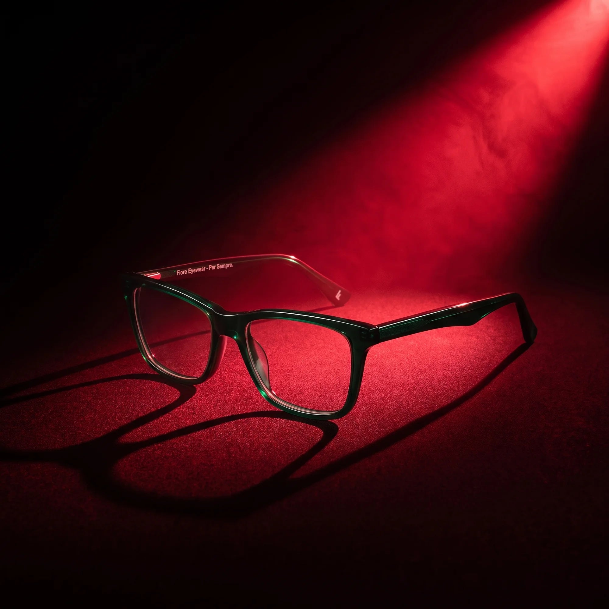 Fiore 5228 eyeglasses in green – under a theatrical beam of light