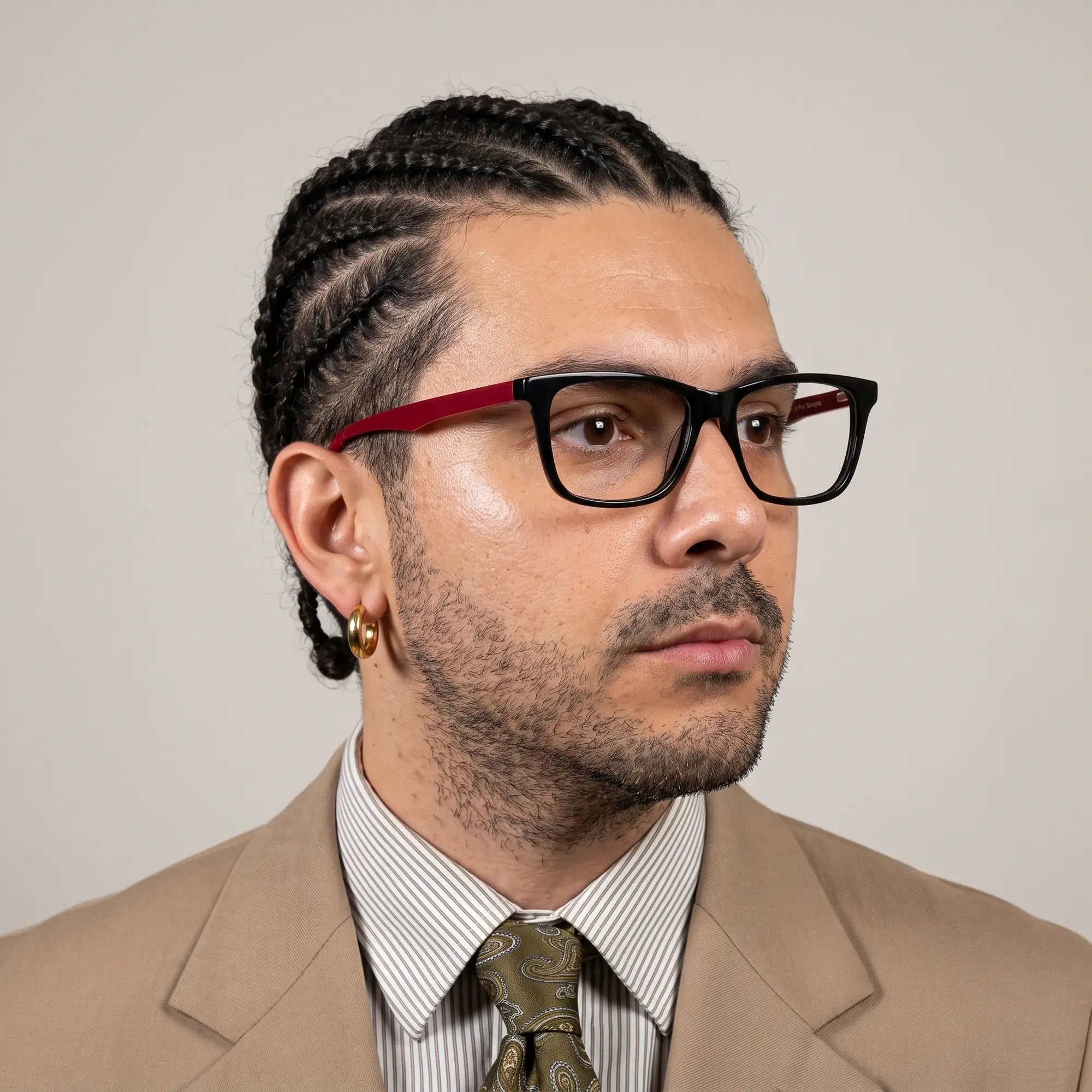 Fiore 5228 eyeglasses in black, worn by a model – campaign portrait, clean beige studio three-quarter portrait