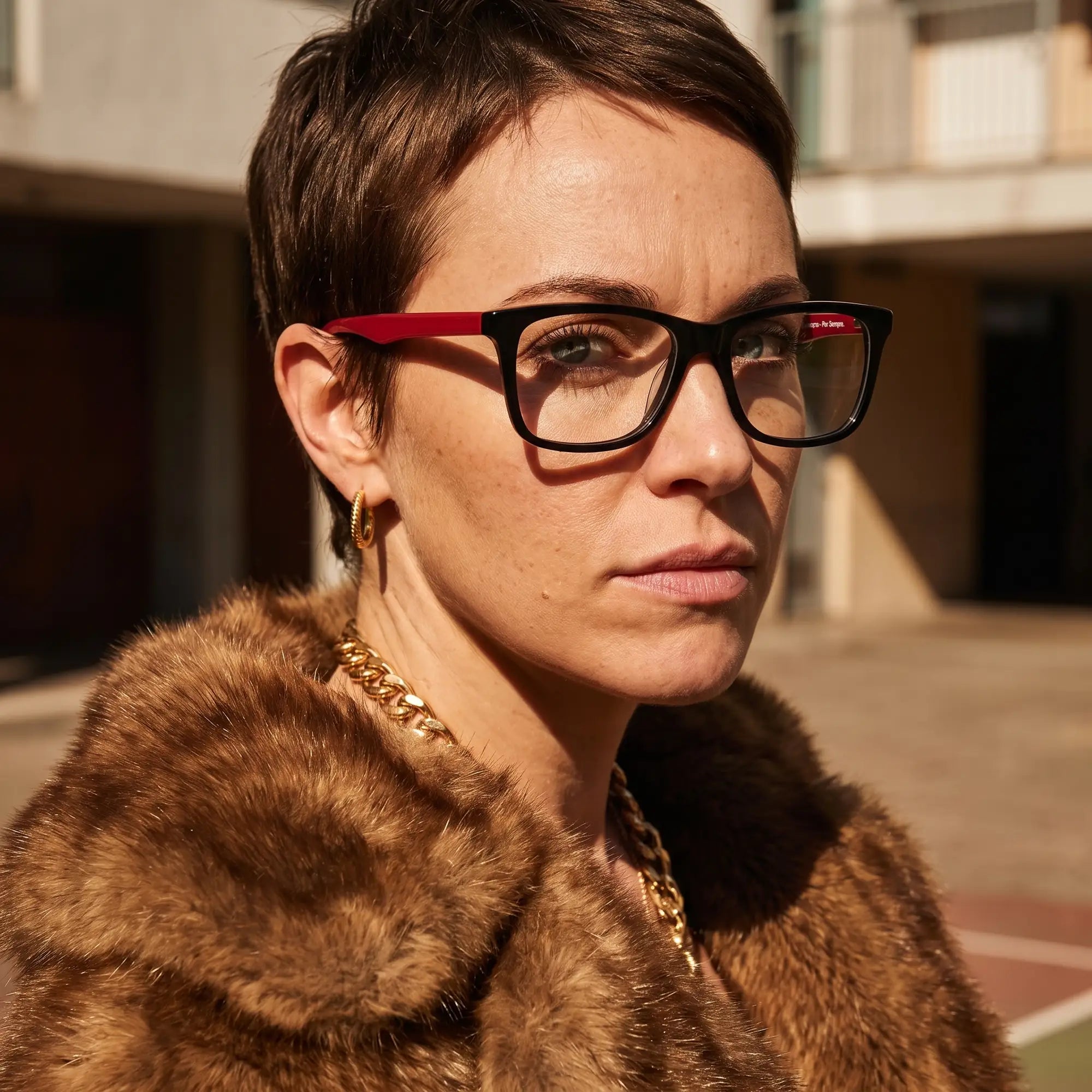 Fiore 5228 eyeglasses in black, worn by a model – campaign portrait, street portrait rooted in city heritage