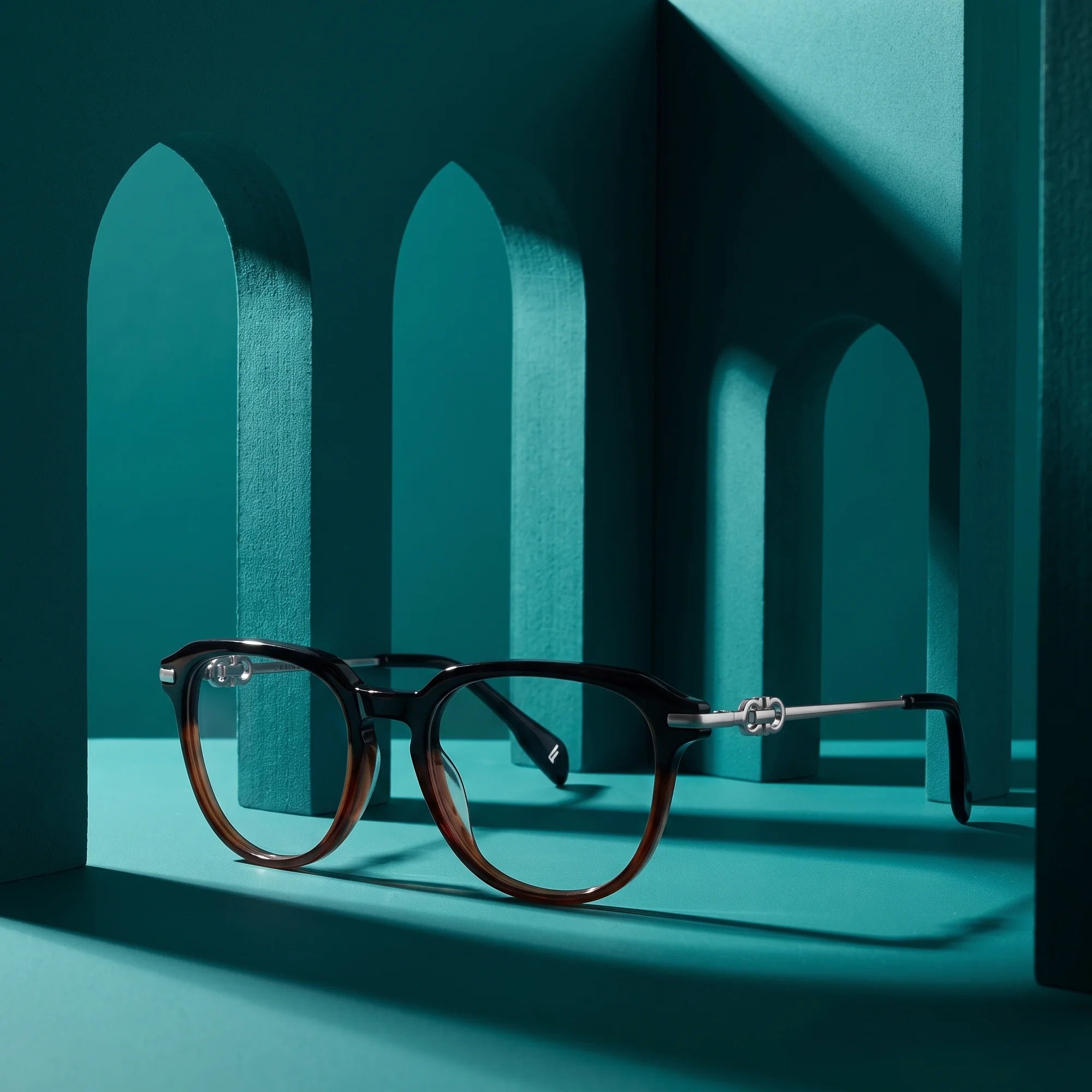 Fiore 5409 eyeglasses in black brown – still life among monochrome teal arches