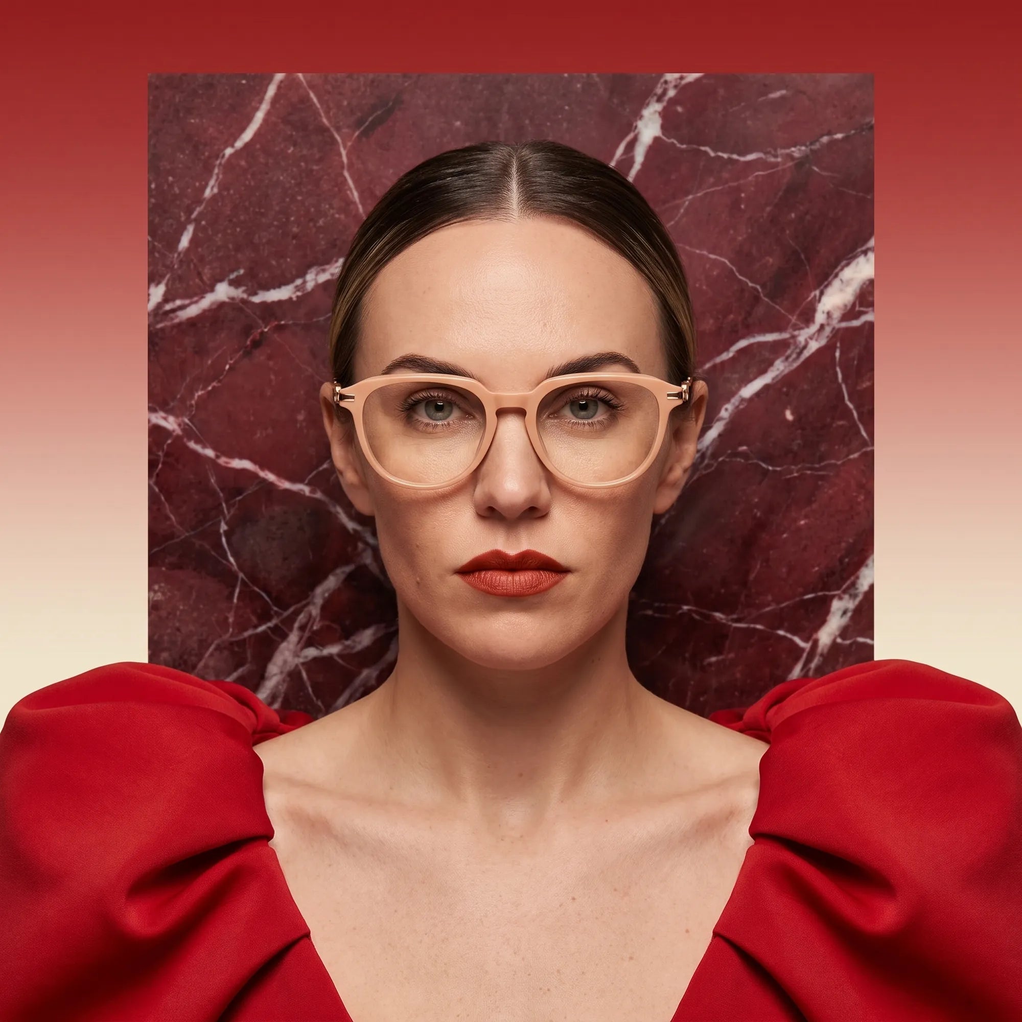 Fiore 5409 eyeglasses in milky white, worn by a model – campaign portrait, red marble backdrop and draped scarlet dress
