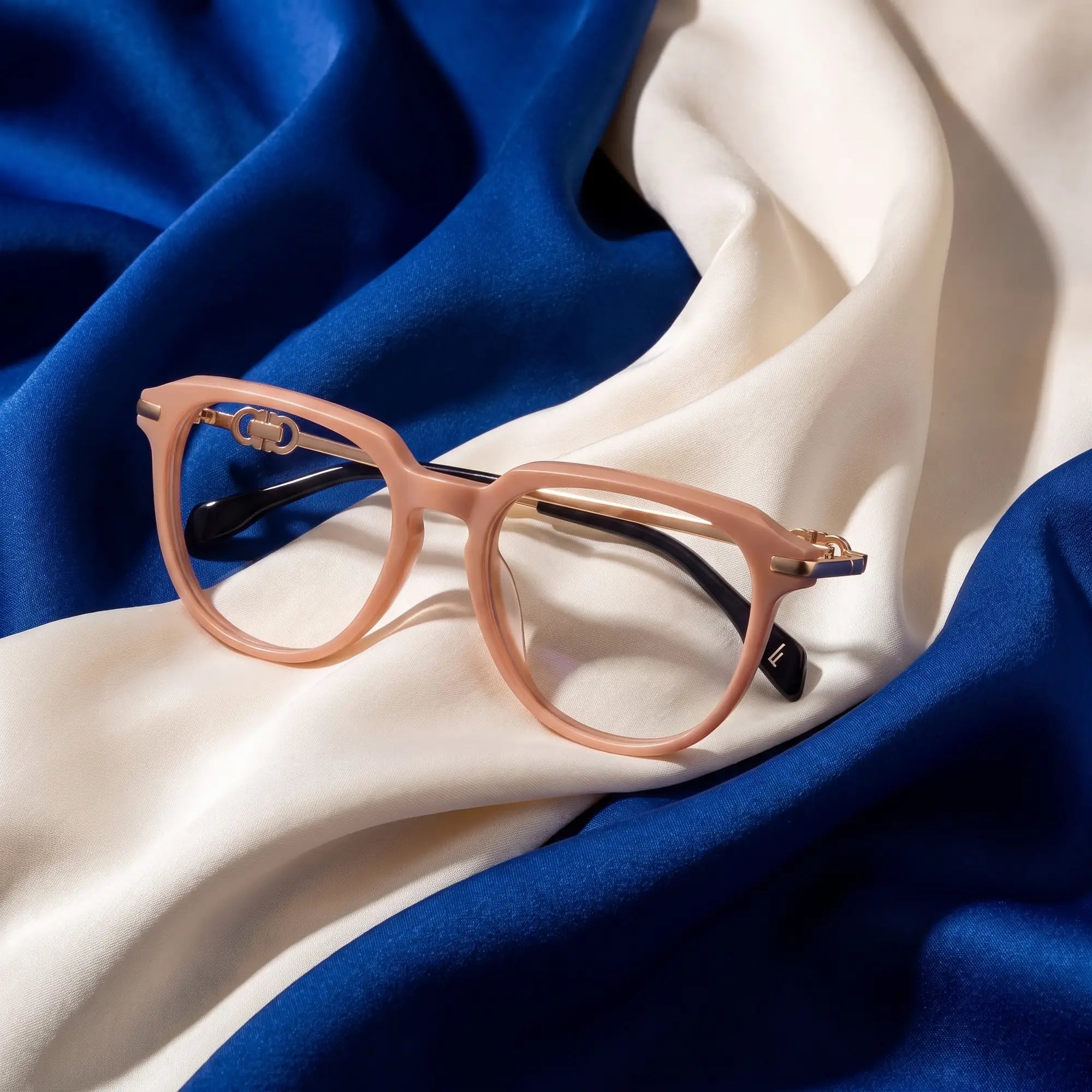 Fiore 5409 eyeglasses in milky white – resting on draped cobalt and ivory silk