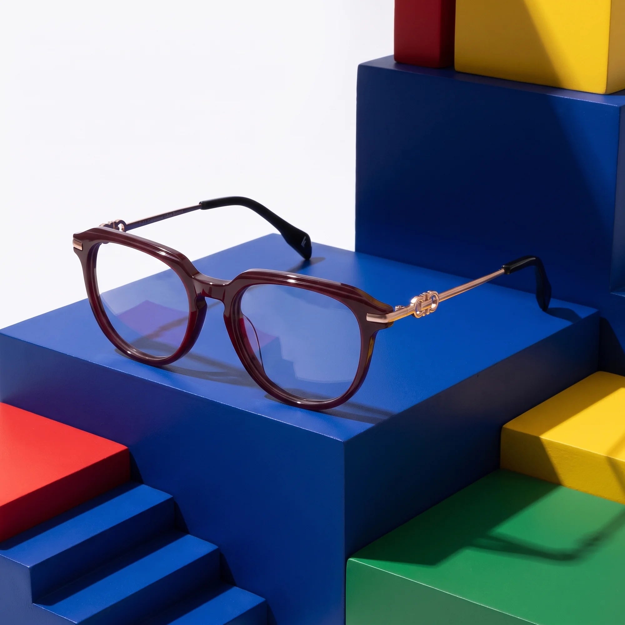 Fiore 5409 eyeglasses in brown red – on bold primary color-block steps