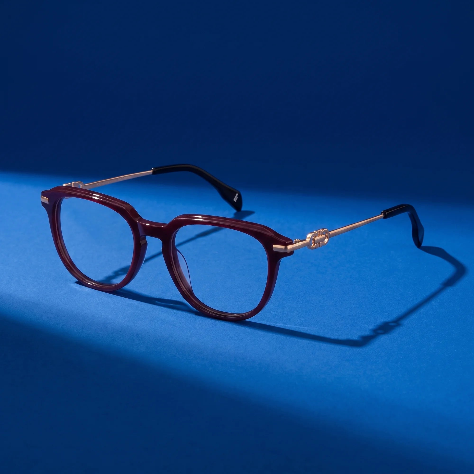 Fiore 5409 eyeglasses in brown red – still life on a seamless cobalt studio backdrop
