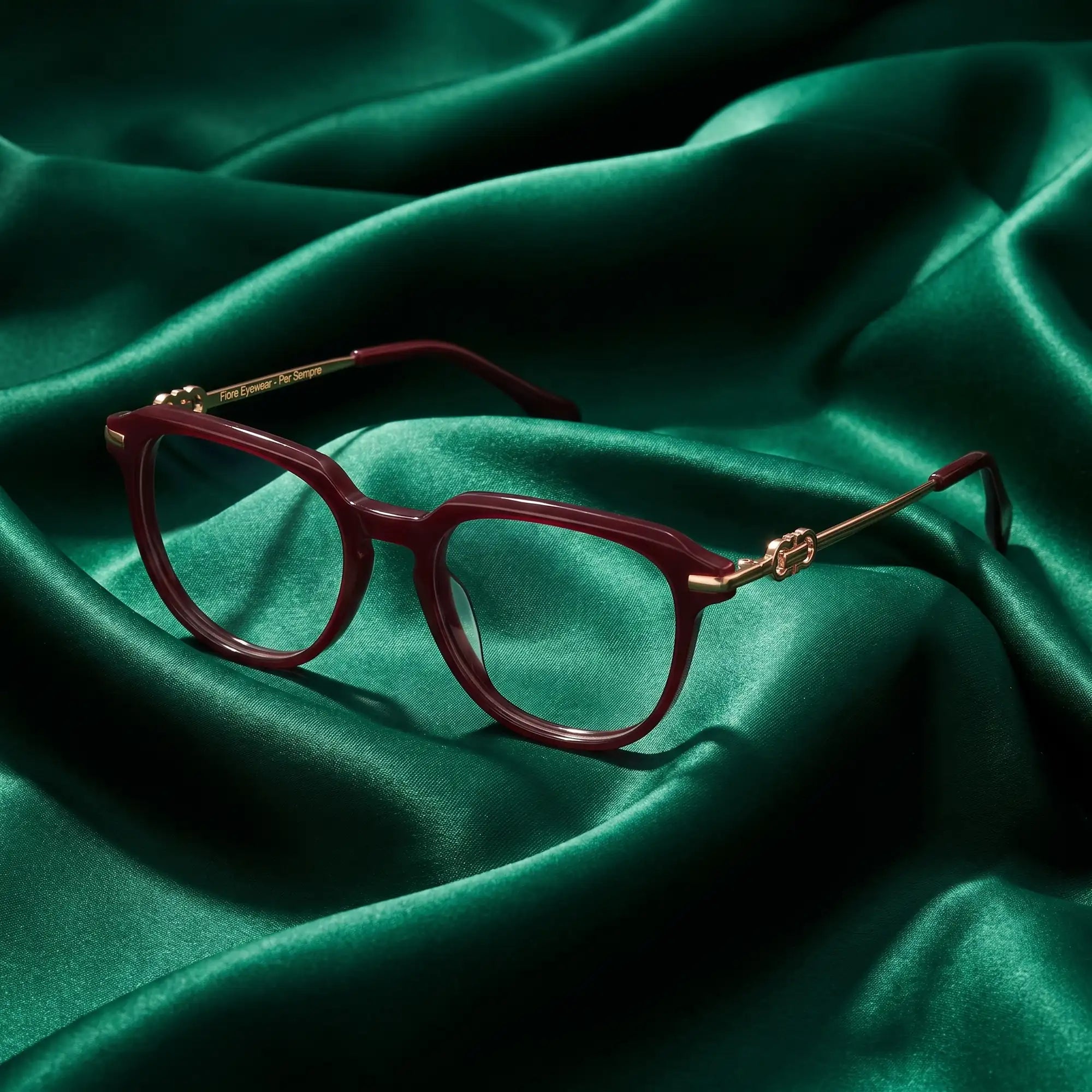 Fiore 5409 eyeglasses in brown red – nested in flowing emerald silk