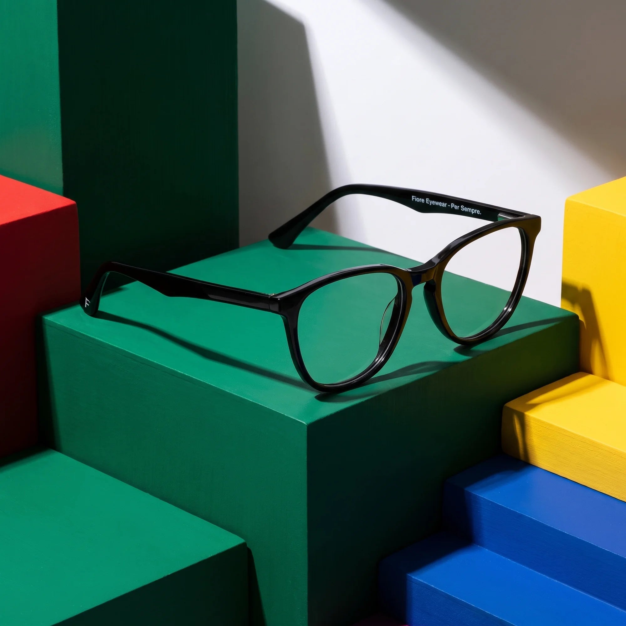 Fiore 7046 eyeglasses in black – on bold primary color-block steps