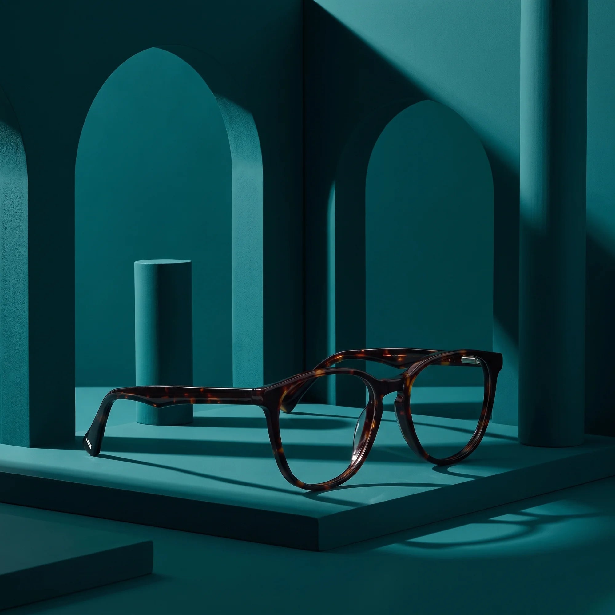 Fiore 7046 eyeglasses in tortoiseshell – still life among monochrome teal arches