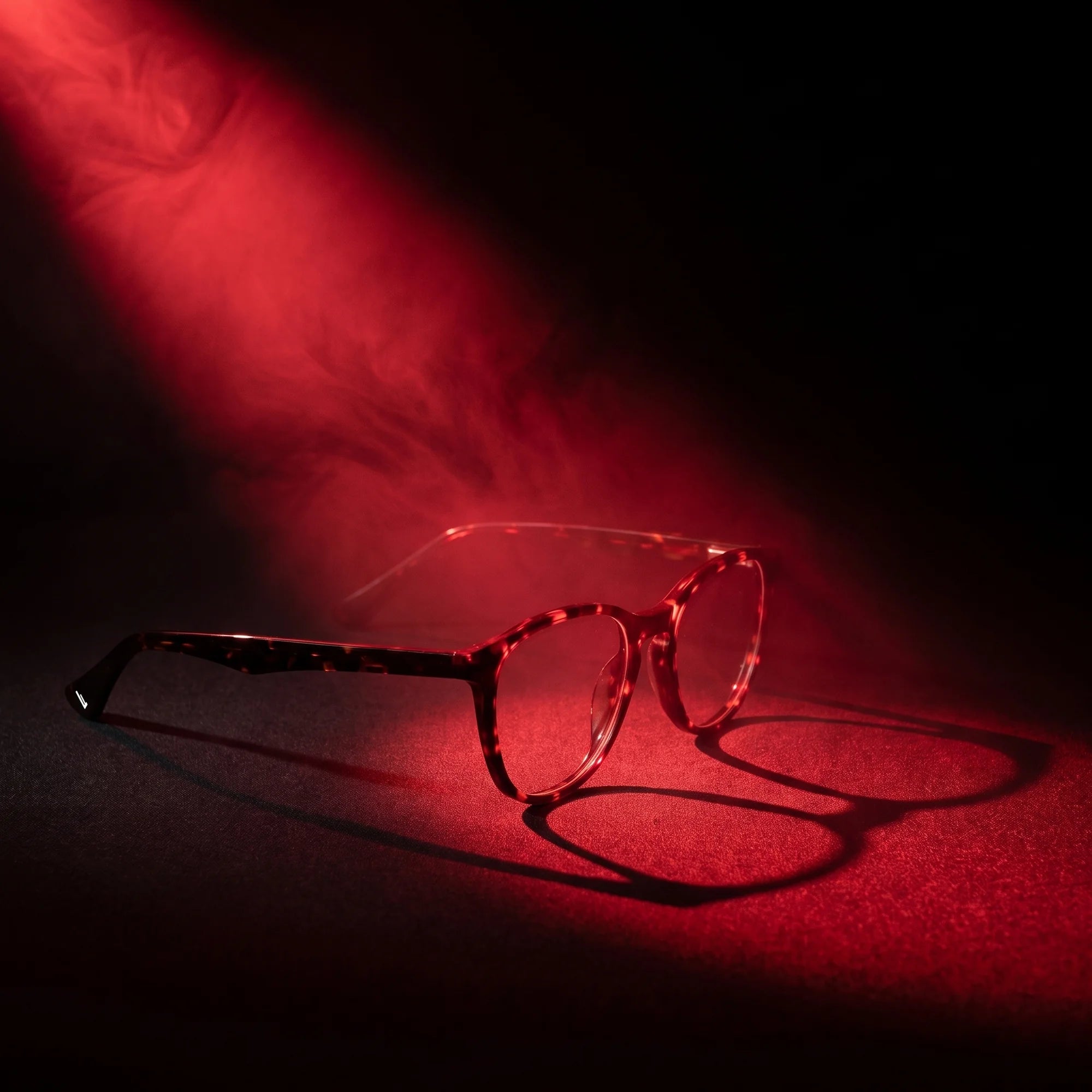 Fiore 7046 eyeglasses in tortoiseshell – under a theatrical beam of light