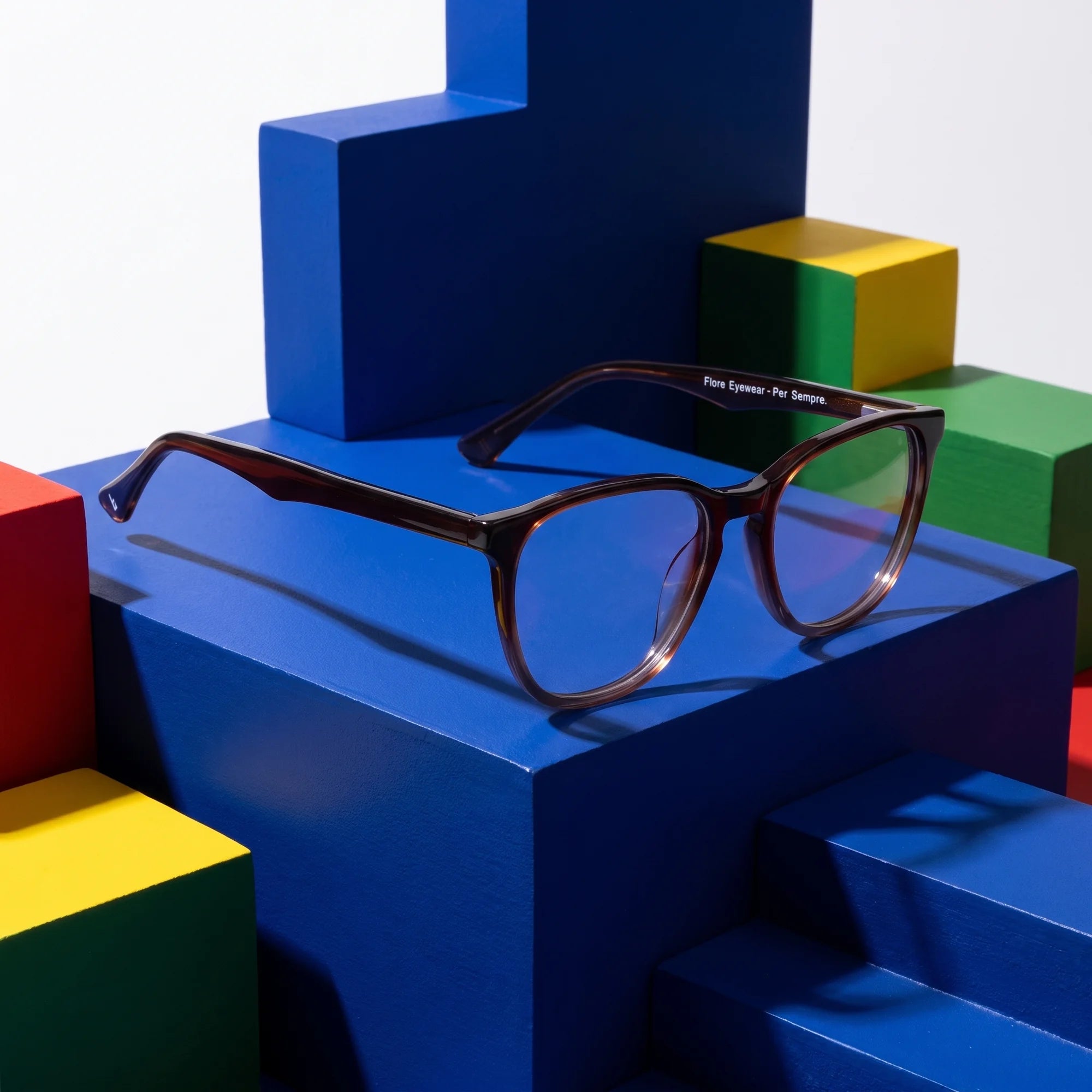 Fiore 7046 eyeglasses in gradual brown – on bold primary color-block steps