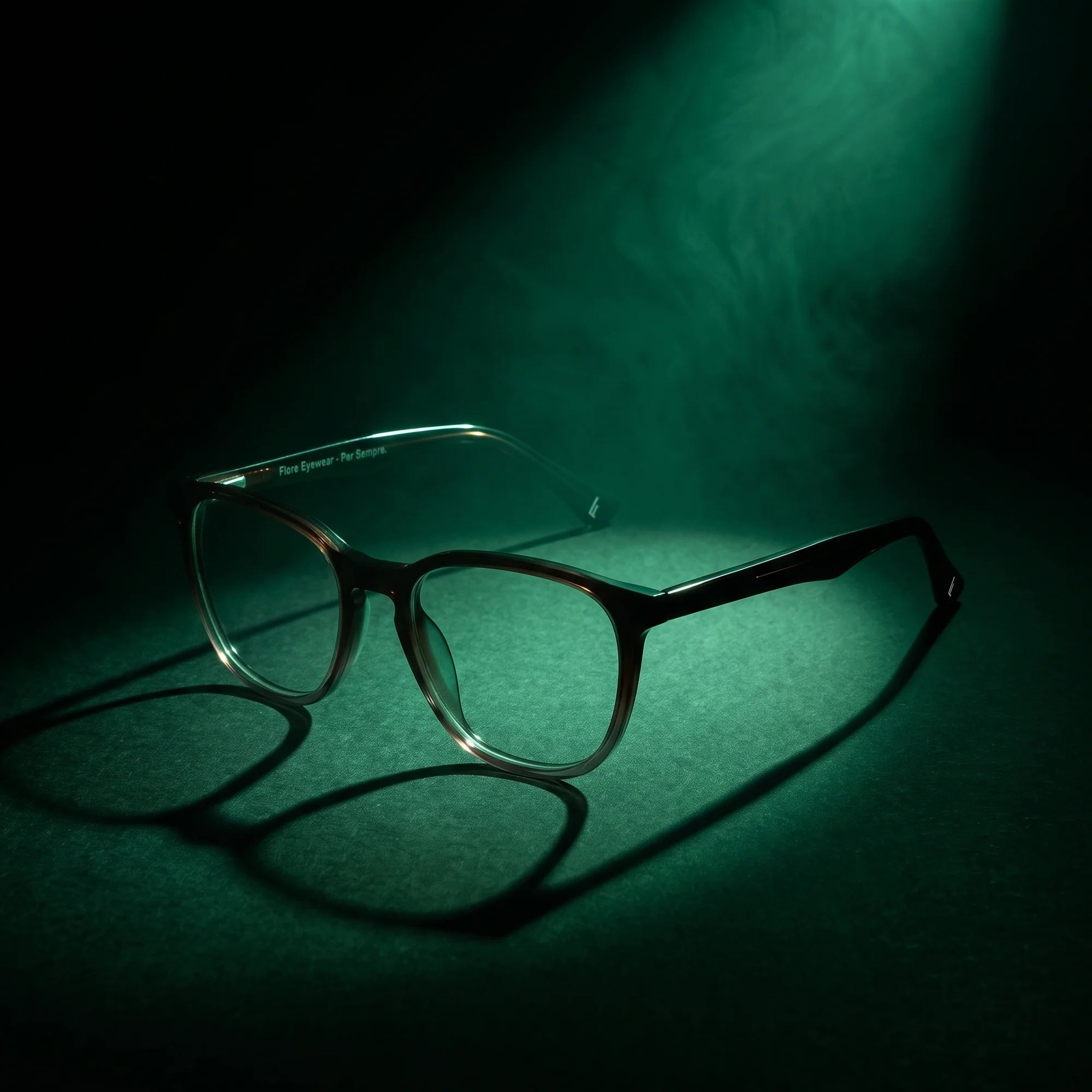 Fiore 7046 eyeglasses in gradual brown – under a theatrical beam of light