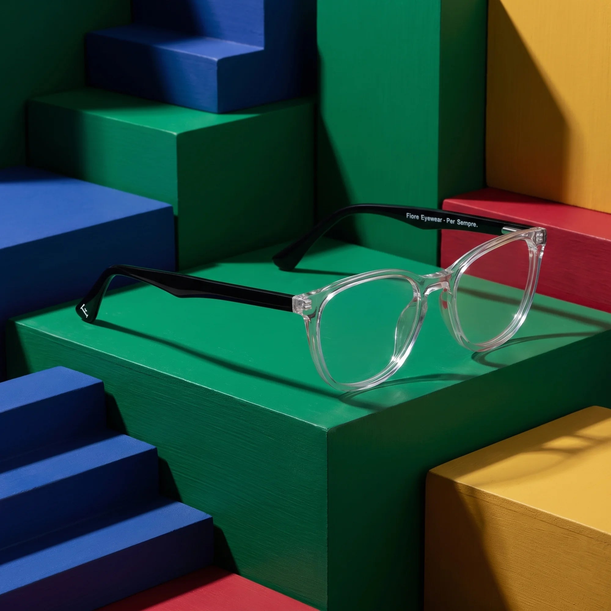 Fiore 7046 eyeglasses in transparent – on bold primary color-block steps
