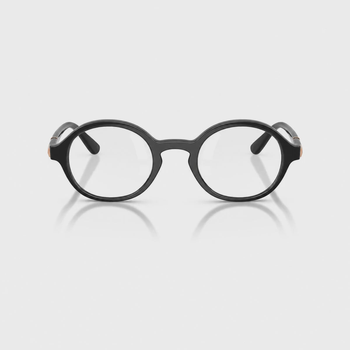 Vogue VO5692S photochromic brown replacement lenses, front video of the lenses darkening from clear to brown · ReFramed