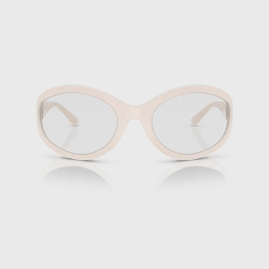 Vogue VO5606S photochromic brown replacement lenses, front video of the lenses darkening from clear to brown · ReFramed