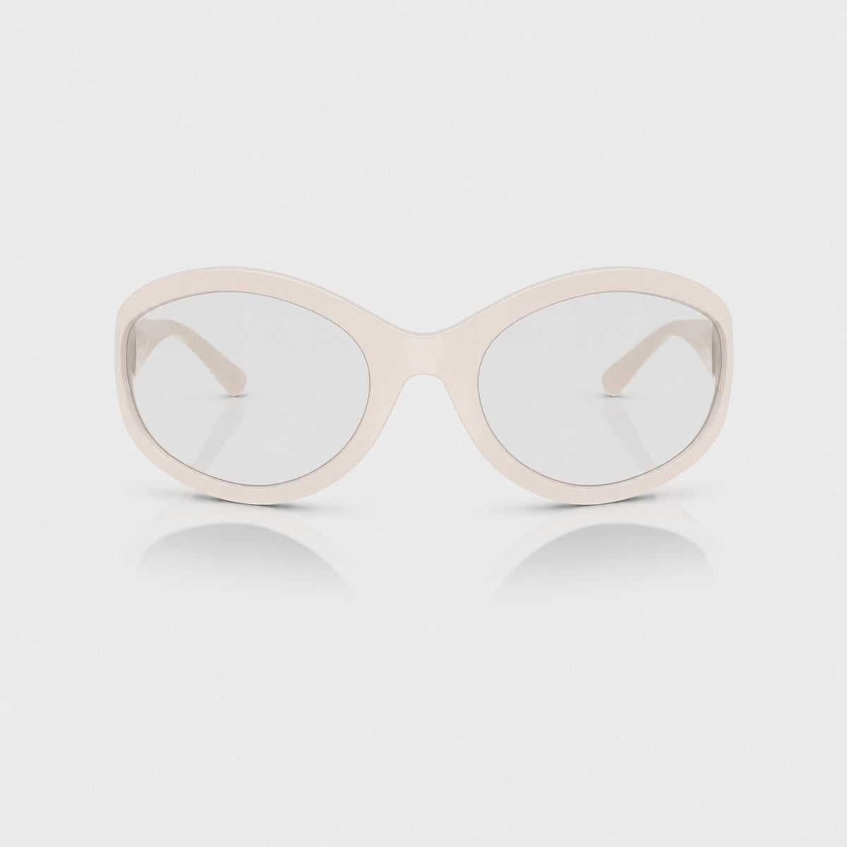 Vogue VO5606S photochromic brown replacement lenses, front video of the lenses darkening from clear to brown · ReFramed